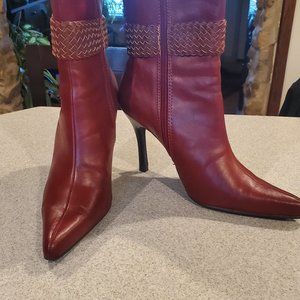 Wine colored all man made boots with side zip and high heels